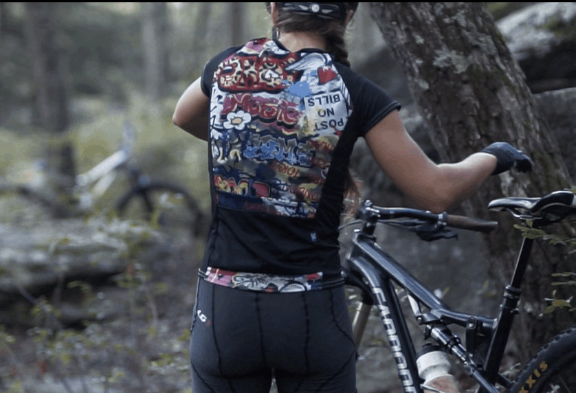 Moxie Tee Jersey Graffiti bike jersey with two back pockets, featuring moisture management technology.